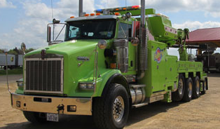 Fuller Environmental green vacuum truck.