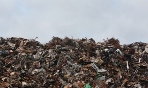 A pile of waste in a junkyard.